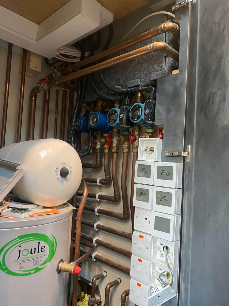 Plumber installing a water boiler